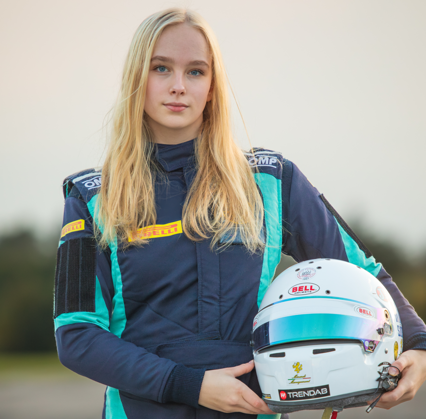 Milla in a racing suit.