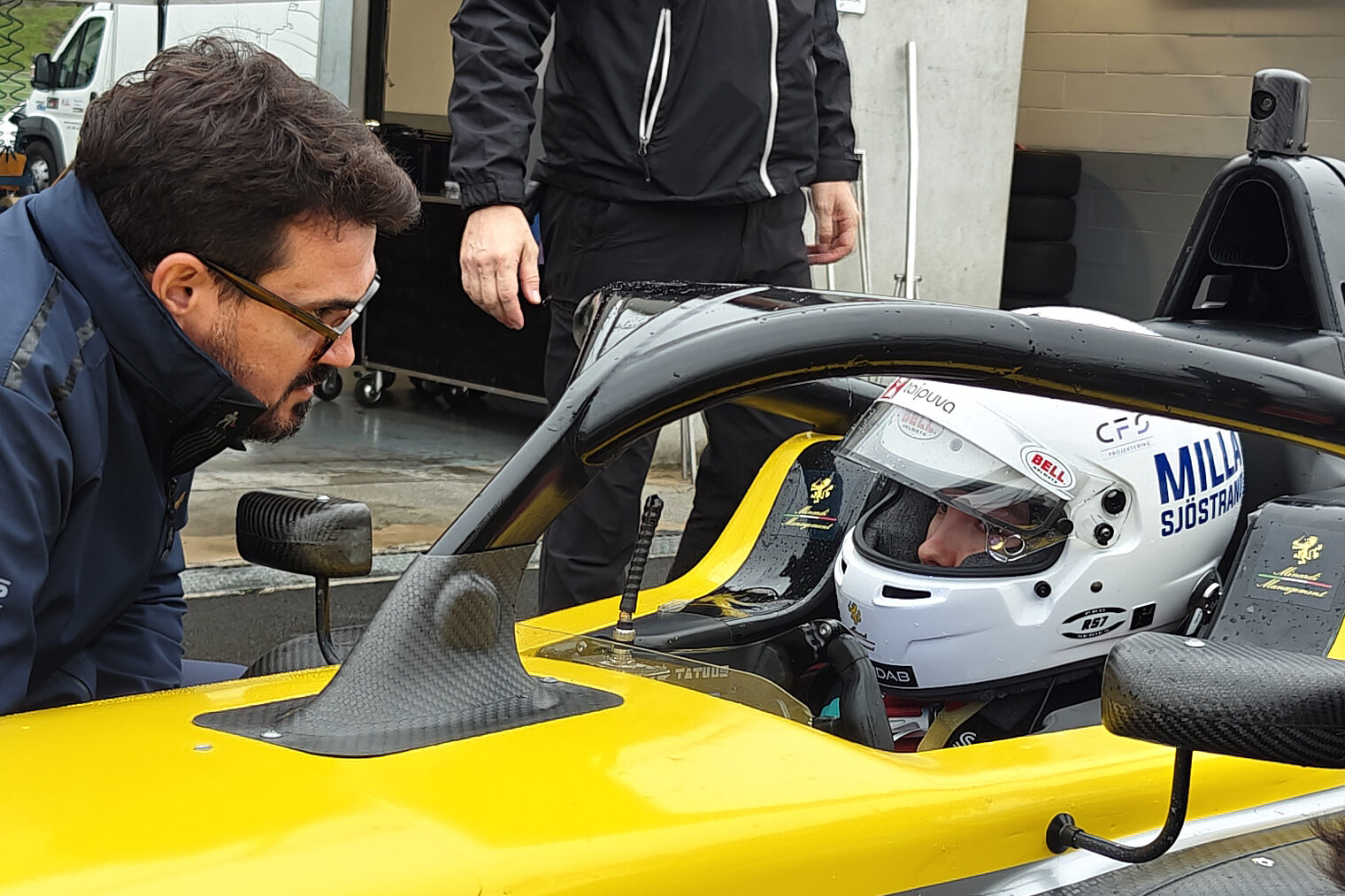 Giovanni Minardi talking to Milla in the F4 car.